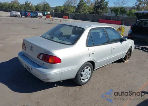 2000 Toyota Corolla Le из США, поврежденный, VIN 1NXBR12E4YZ325974